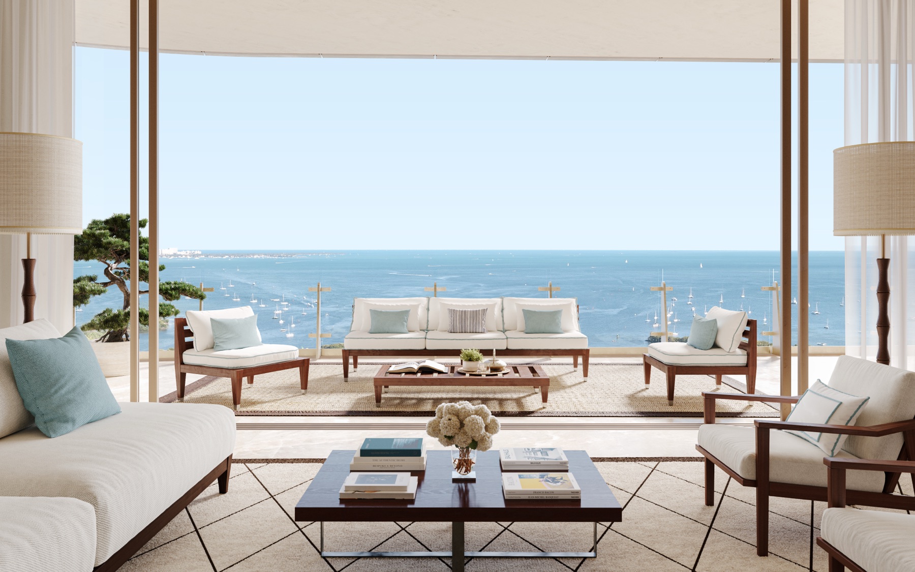 Curved glass balcony at Four Seasons Private Residences Coconut Grove — bayfront terrace overlooking Biscayne Bay, with 11 ft ceilings and a minimum 10 ft depth.