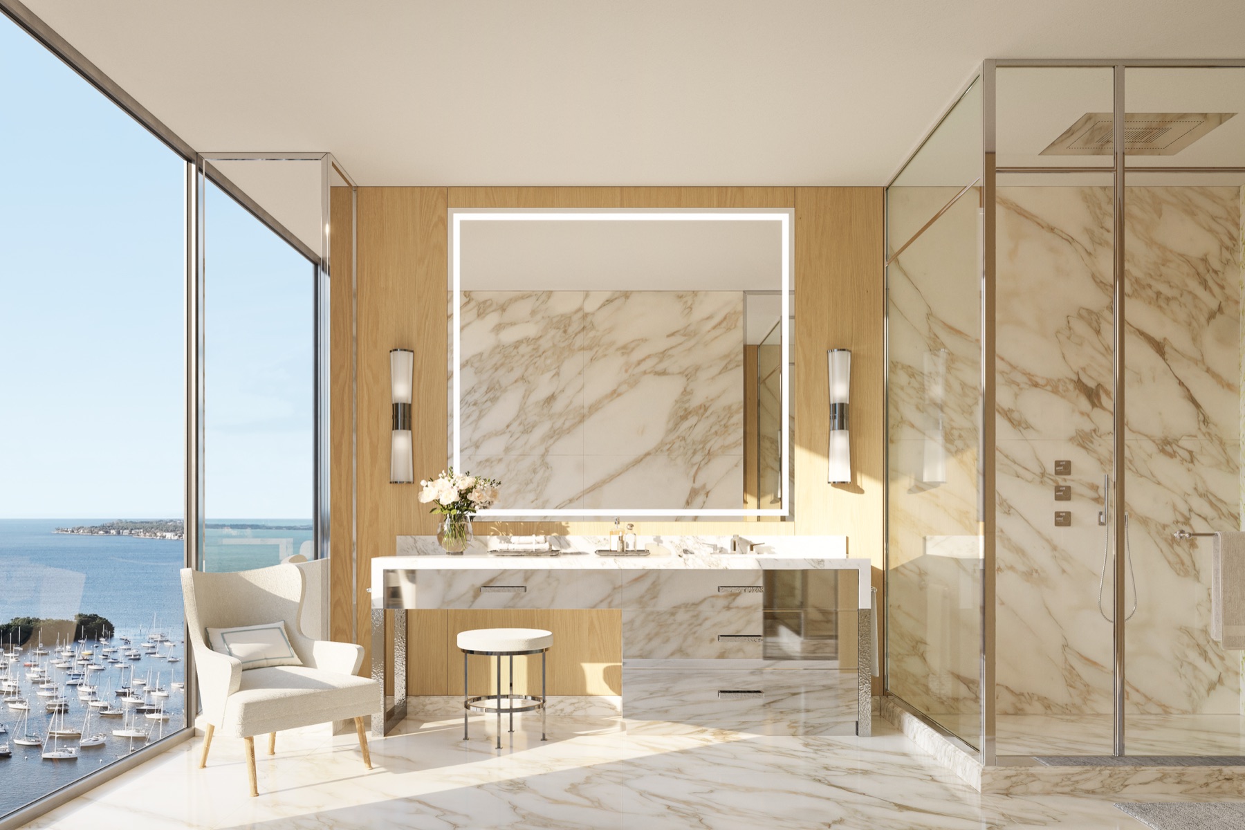Primary bathroom view at Four Seasons Private Residences Coconut Grove — Calacatta and Carrara marble with Italian travertine floors, designed by Michele Bönan Interiors.