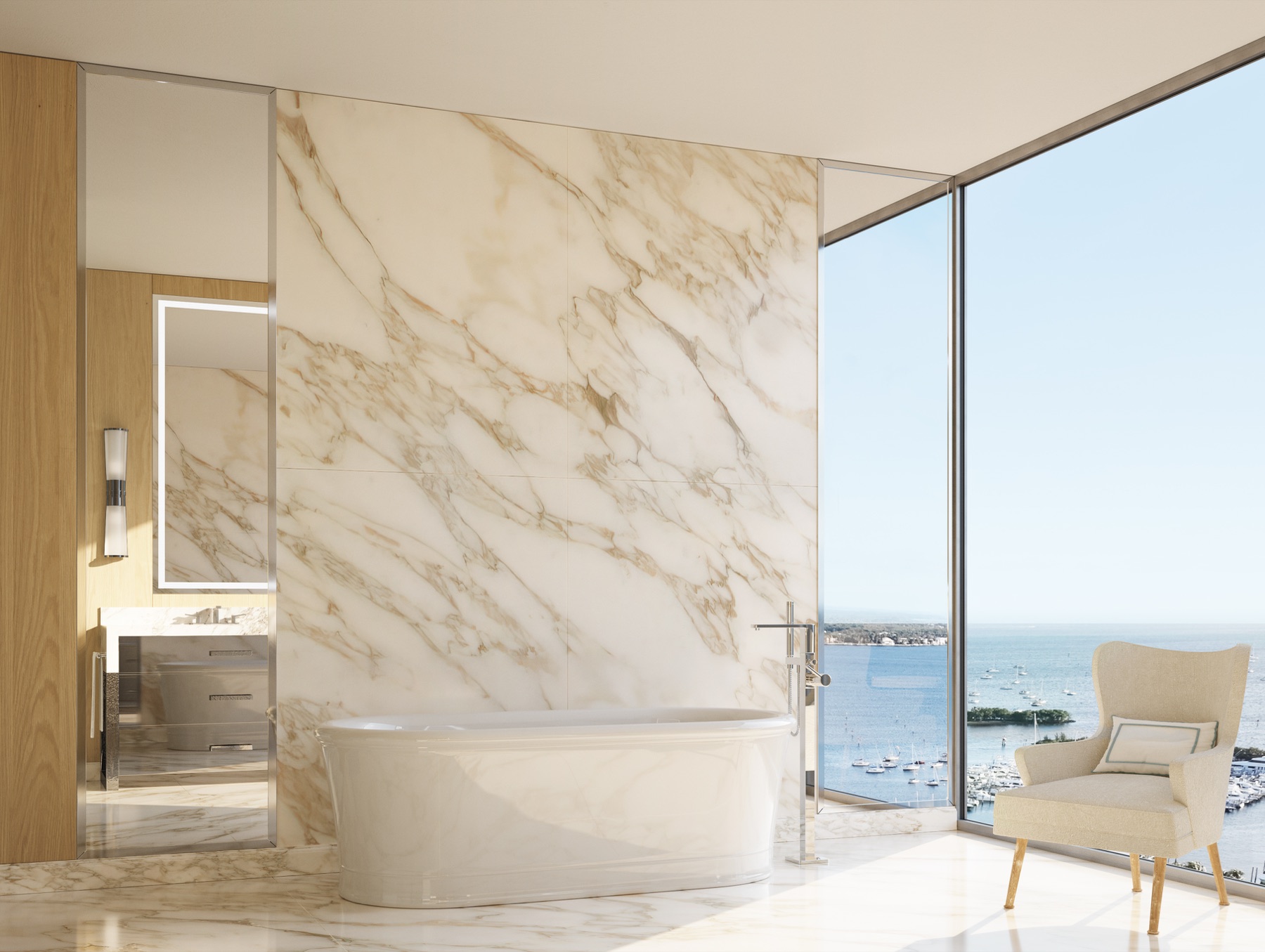 Primary bathroom at Four Seasons Private Residences Coconut Grove — vein-matched polished slab Italian marble floor and walls, custom bathroom cabinetry, deep-soaking bathtub.