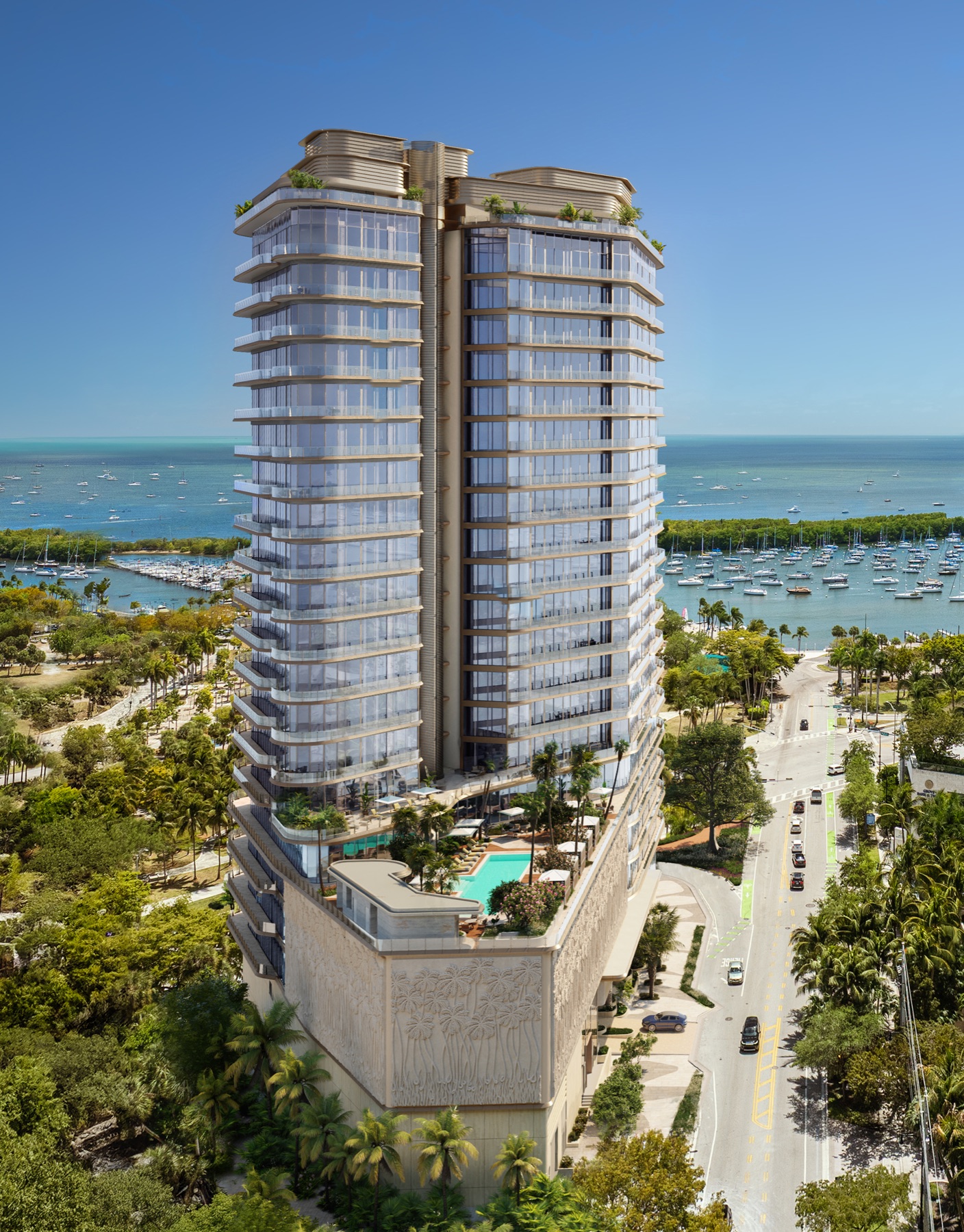 Pool deck and Biscayne Bay view at Four Seasons Private Residences Coconut Grove — open-air pool framed by Coconut Grove's tropical landscape with the bay beyond.